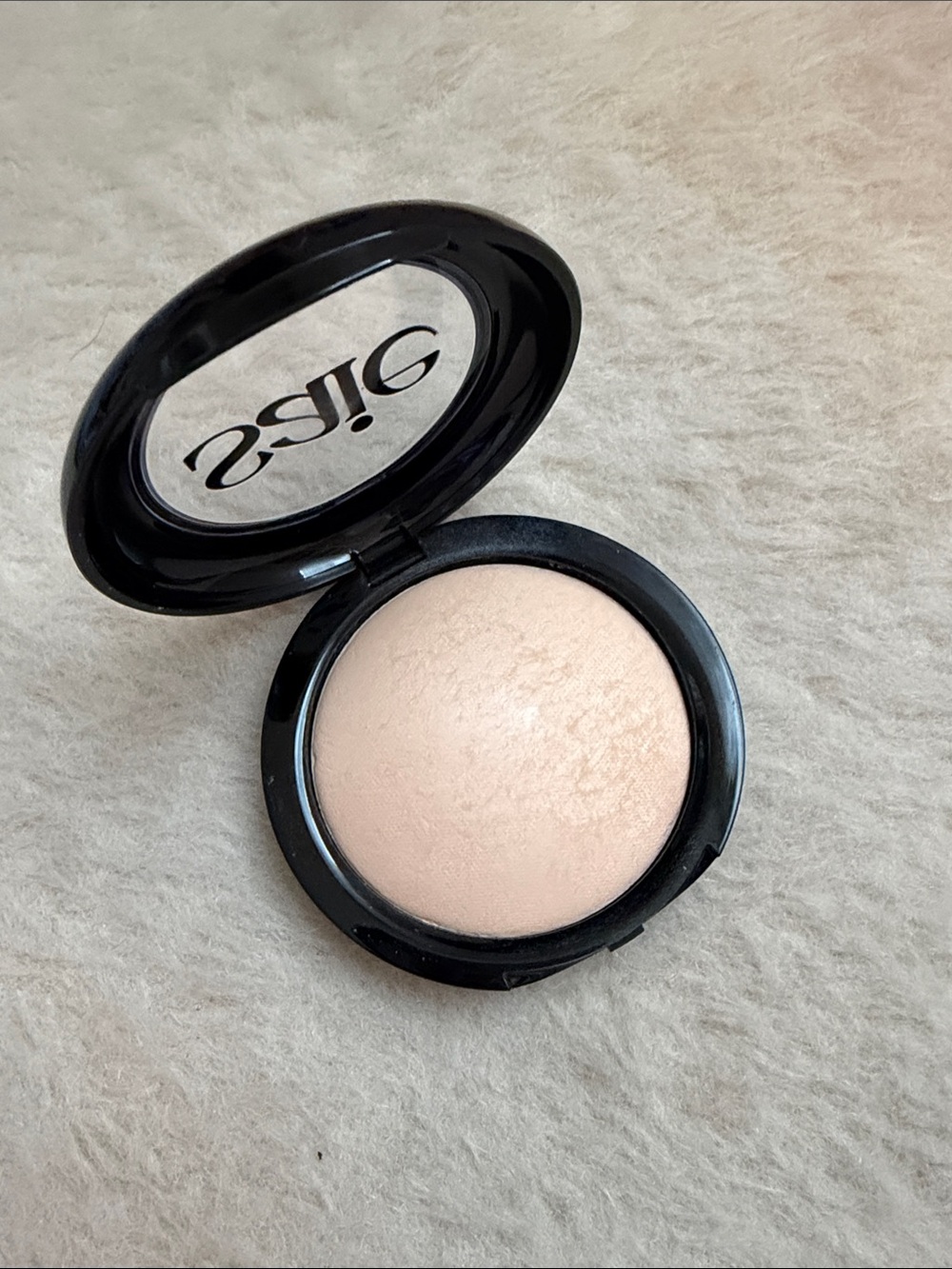 Saie Slip Tint pressed powder shade 1 translucent